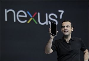 Huga Barra, director of product management for Android, shows the Nexus 7 tablet at the Google I/O conference in San Francisco.