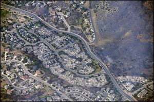 This aerial photo taken on Wednesday shows burned homes in the Mountain Shadows residential area of Colorado Springs, Colo., that were destroyed by the Waldo Canyon wildfire. 