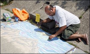 Pilar Resendez of Toledo competes in a sidewalk chalk drawing competition during the Cherry Street Mission Ministries 65th anniversary event Saturday, in Toledo, Ohio.