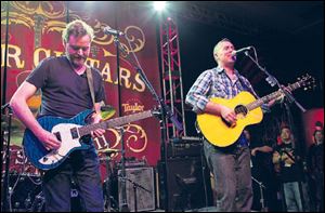 Kevin Hearn, left, and Ed Robertson of the band Barenaked Ladies perform last year at the Anaheim Convention Center in Anaheim, Calif.