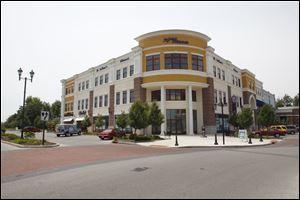 People still flock to Levis Commons to shop, relax, or eat. The main shopping portion of Levis Commons, known as the Town Center, is financially sound. The Town Center is 92 percent leased and has just three vacancies, says Charlene Scott, the Town Center's general manager.