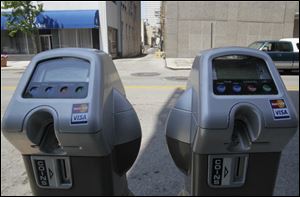 Parking meters that accept credit or debit cards are in use on two blocks of Madison Avenue, but the number is to expand to 400 by early fall. 