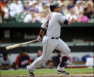 Cleveland Indians' Jose Lopez follows through on a lead-off double against the Baltimore Orioles during the fourth inning of a baseball game, Sunday.