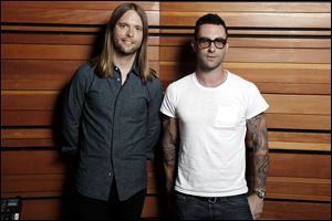 Adam Levine, right, and James Valentine of the band Maroon 5, which released the album 