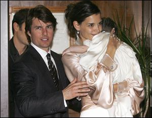 Tom Cruise, and U.S. actress Katie Holmes with their daughter Suri.
