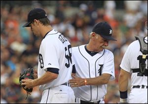 Detroit Tigers starting pitcher Doug Fister is replaced by manager Jim Leyland during the fifth inning of a baseball game against the Minnesota Twins.