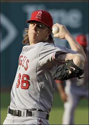 The Angels Jered Weaver delivers against the Indians in the first inning on Monday. He allowed five hits and struck out two with three walks over seven innings while not allowing an earned run in the Angels' 3-0 victory.