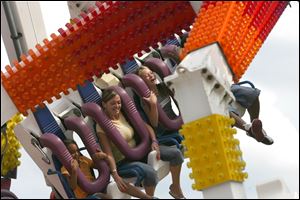 Fairgoers on the Fire ball during a past Lucas County Fair.