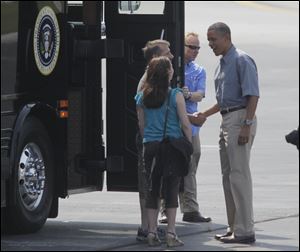 Jeff and Cheri Armes greet the President before boarding
the bus with him at Toledo Express Airport.