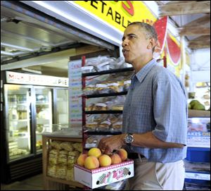 The President buys fruit at Bergman Orchards farm market in Port Clinton.