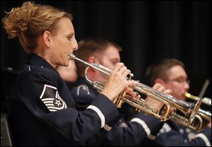 Master Sgt. Carie Cufr of Perrysburg, a trumpeter in the 32-member concert band, participates in its farewell performance.