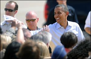 President Obama greets staff and family members of the 911th Airlift Wing in Coraopolis, Pa., Friday.