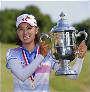 South Korea's Na Yeon Choi holds up the championship trophy after winning during the U.S. Women's Open on Sunday in Kohler, Wis.