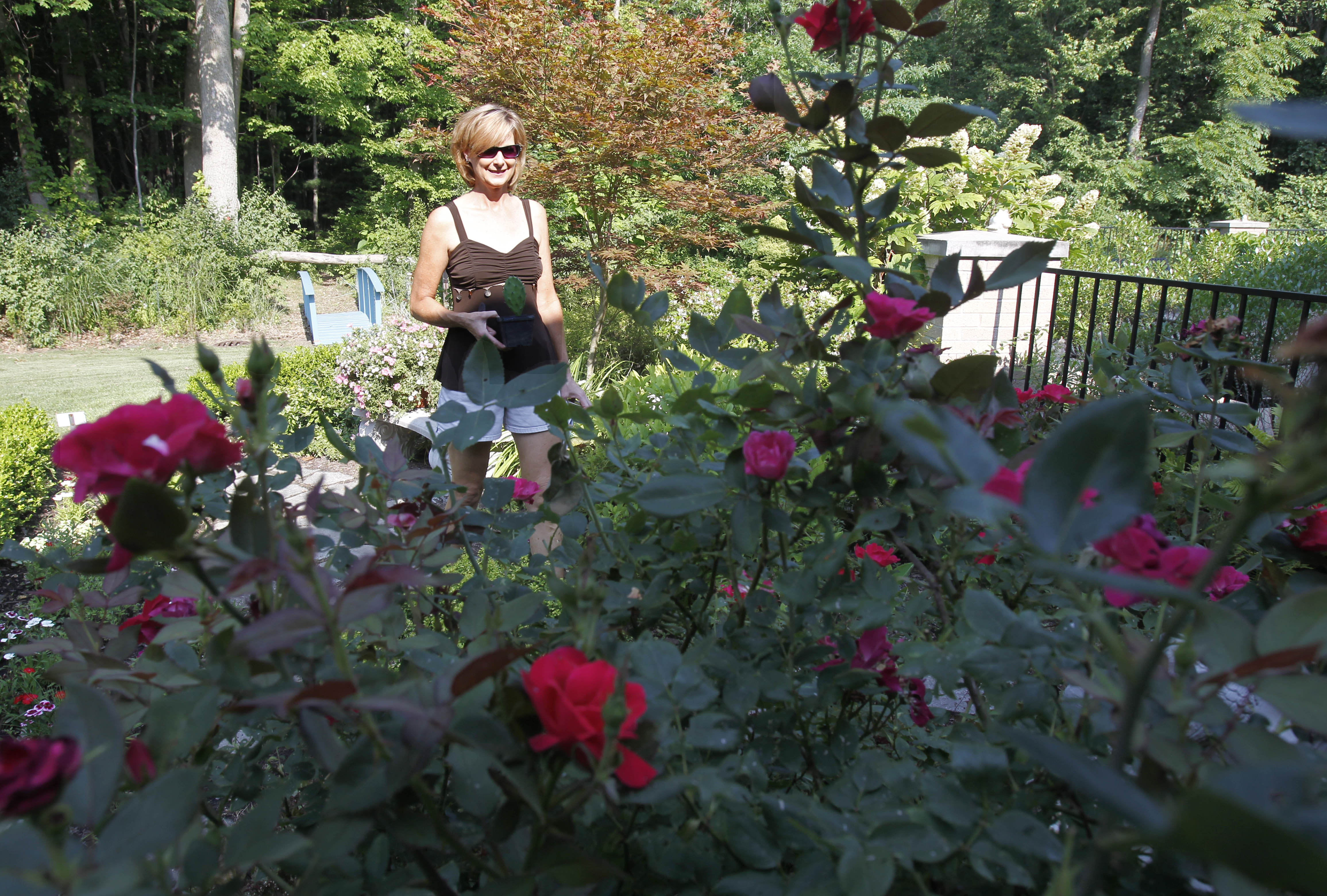 Visitors brave the heat on the Bedford Flower and Garden Club Tour