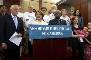 House Minority Leader Nancy Pelosi of Calif., flanked by House Minority Whip Steny Hoyer of Md., left, and House Assistant Minority Leader James Clyburn of S.C., speaks about the Affordable Care Act, Wednesday on Capitol Hill.
