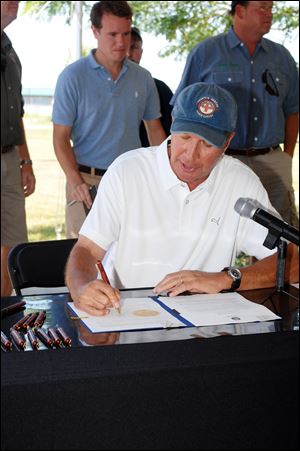 Gov. John Kasich signs legislation that bans drilling for oil and gas on Lake Erie.