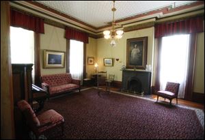 The red parlor inside the Hayes home is one of the 31 rooms in the mansion restored to its previous character.
