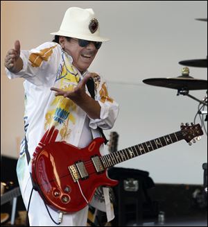 Carlos Santana never lost the beat during a two-hour performance that kept the crowd moving Wednesday at the Toledo Zoo Amphitheatre. He used an 11-person band that fused Latin, rock, rhythm and blues, and jazz, during a set that showcased hits like 'Smooth' and 'Black Magic Woman.'  