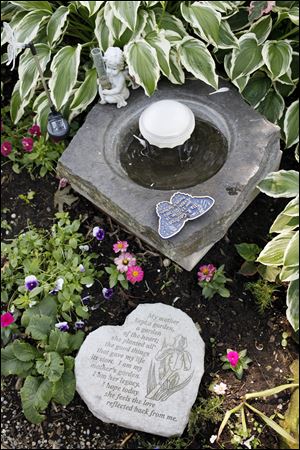 Memorial to Ila R. Geoffrion in the backyard of Ken and Julie Peace's home on Gribbin Lane Tuesday. Geoffrion was Julie's mother.