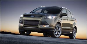 Ford Motor Co. is recalling more than 10,000 redesigned 2013 Escape SUVs to fix carpet padding that could get in the way of braking.