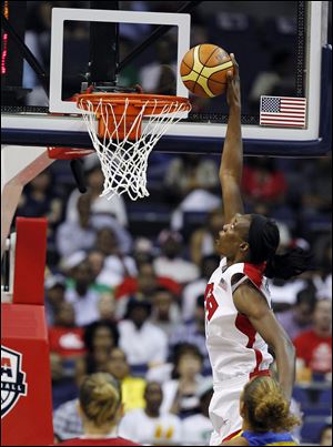 Team USA center Sylvia Fowles goes up for a dunk, which bounced out, during the second half of an Olympic women's exhibition basketball game with Brazil on Monday in Washington. The United States won 99-67. 