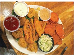 Fried perch and shrimp with cole slaw and sweet potato chips.