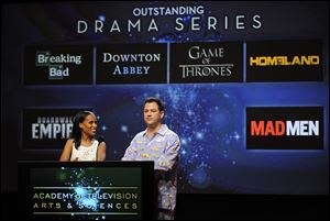 Actress Kerry Washington, left, and comedian Jimmy Kimmel, wearing pajamas, announce the nominees for Outstanding Drama Series during the nominations for the 64th Primetime Emmy Awards at the Academy of Television Arts & Sciences in Los Angeles.