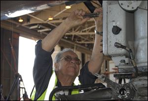 Azriel 'Al' Blackman, 86, reports to work every day at American Airline's aircraft maintenance hangar at John F. Kennedy International Airport. 'I don't consider it work, really,' he says. 'If you like what you do, it's not work.' He was 16 when he started as an apprentice mechanic in July of 1942. 