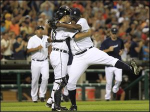Detroit Tigers relief pitcher Jose Valverde celebrates the Tigers' 4-2 win over the Chicago White Sox with catcher Alex Avila in the ninth inning of a baseball game in Detroit, Friday.