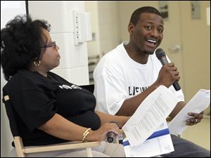 Coleena Ali, left, and Greg Braylock, Jr., right, lead the discussion about aspirations for the Central City Community during a 