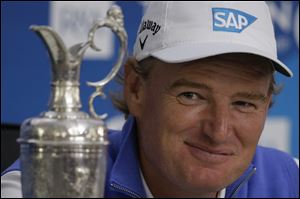 Ernie Els of South Africa won his fourth major championship in an astonishing finish, rallying to beat Adam Scott in the British Open. 
