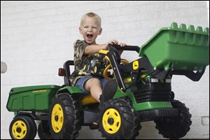 Lucas Bredberg, 4, won first place in the Lucas County Fair's pedal tractor pull competition. He is to vie for the state championship in Bucyrus on Aug. 25.