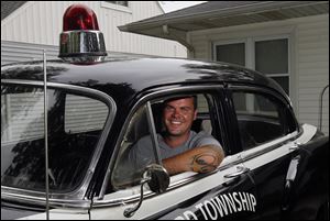 Jason Wojcik of Perrysburg traded his 1930 Model A Ford for this 1953 Chevrolet police cruiser. The police car's red light on the roof still works.
