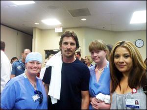 Christian Bale, star of ‘The Dark Knight Rises,’ meets medical staff members at Swedish Medical Center.