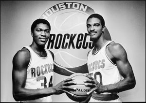 Ralph Sampson, right, was one-half of the Houston Rockets' Twin Towers (along with Hakeem Olajuwon), which helped earn him a place among the 2012 Naismith Hall of Fame class.