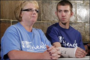 Sarah Hankins and her son Gage speak to reporters in Forest, Ohio, about their experiences in Aurora, Colo. Gage Hankins was wounded by shrapnel that came through the wall of an adjoining theater.