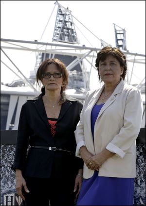 Ilana Romano, left, and Ankie Spitzer, widows of two Israeli Olympians killed at the 1972 Games, in front of London’s Olympic village. 