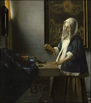 Vermeer’s ‘Woman Holding a Balance’ (1664) will be on view at the Detroit Institute of Arts Aug. 8-Sept. 2.