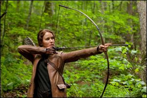Jennifer Lawrence portrays Katniss Everdeen in a scene from 