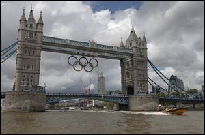 The iconic Tower Bridge spanning the river Thames shows its Olympic spirit in welcoming the world.