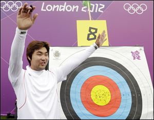 South Korea's Im Dong-hyun celebrates his world record during Friday's individual ranking round. He is legally blind.