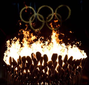 The Olympic cauldron burns following the opening ceremonies to the 2012 Summer Olympics in London on Saturday.