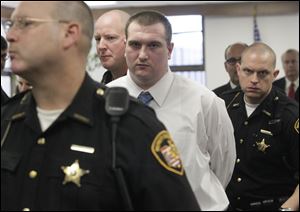 Samuel Williams is escorted from the courtroom by Lucas County sheriff's deputies after a jury that deliberated seven hours over two days found him guilty. 