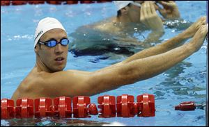 The United States' Ryan Lochte gets in a workout in preparation for the start of today's competition. He opens with the 400-meter individual medley, where he will face off against Michael Phelps.