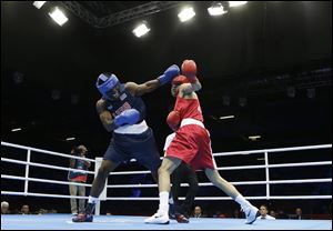 USA's Terrell Gausha fights Armenia's Andranik Hakobyan, right, during a middle weight 75-kg preliminary boxing match at the 2012 Summer Olympics.