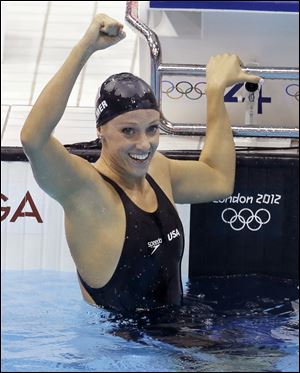 USA's Dana Vollmer won an Olympic gold in the 100 meter butterfly with a world-record time of 55.98 seconds.