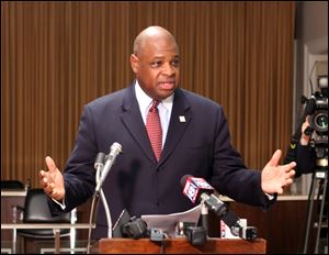 Eugene Sanders, shown here at a news conference in 2010, has been offered a job as a consultant to help run the Sandusky public Schools. 