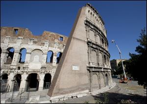 Technicians drop stones from the top of Rome's ancient Colosseum to evaluate possible risks to visitors earlier this month.