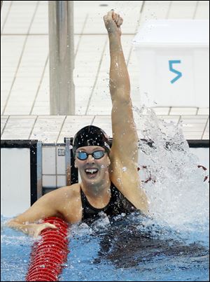 United States' Allison Schmitt celebrates her gold medal win in the women's 200-meter freestyle swimming final at the Aquatics Centre in the Olympic Park during the 2012 Summer Olympics, London, Tuesday.