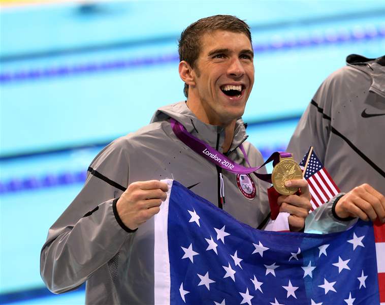 USA-s-Michael-Phelps-celebrates-with-his-Gold-Medal